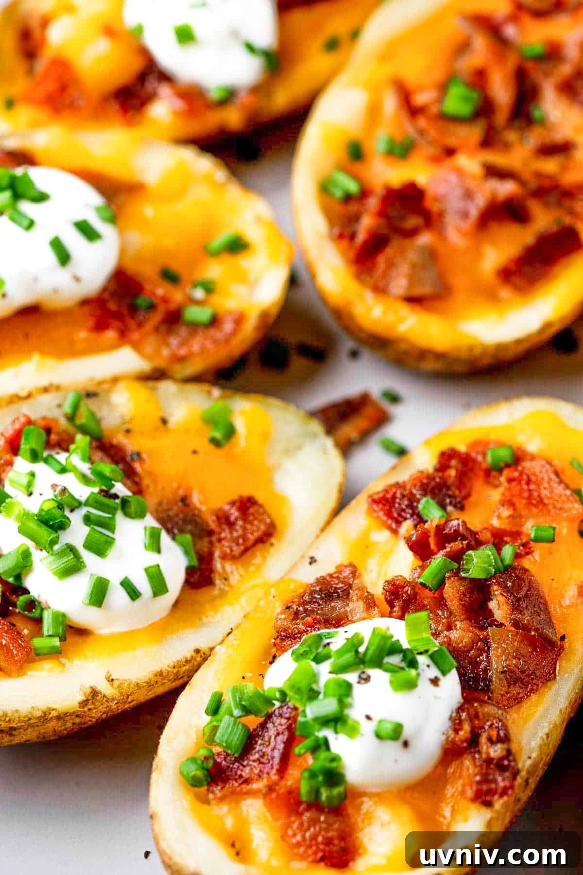 Crispy Air Fryer Potato Skins with Cheesy Bacon Filling 2 plate of air fryer potato skins.