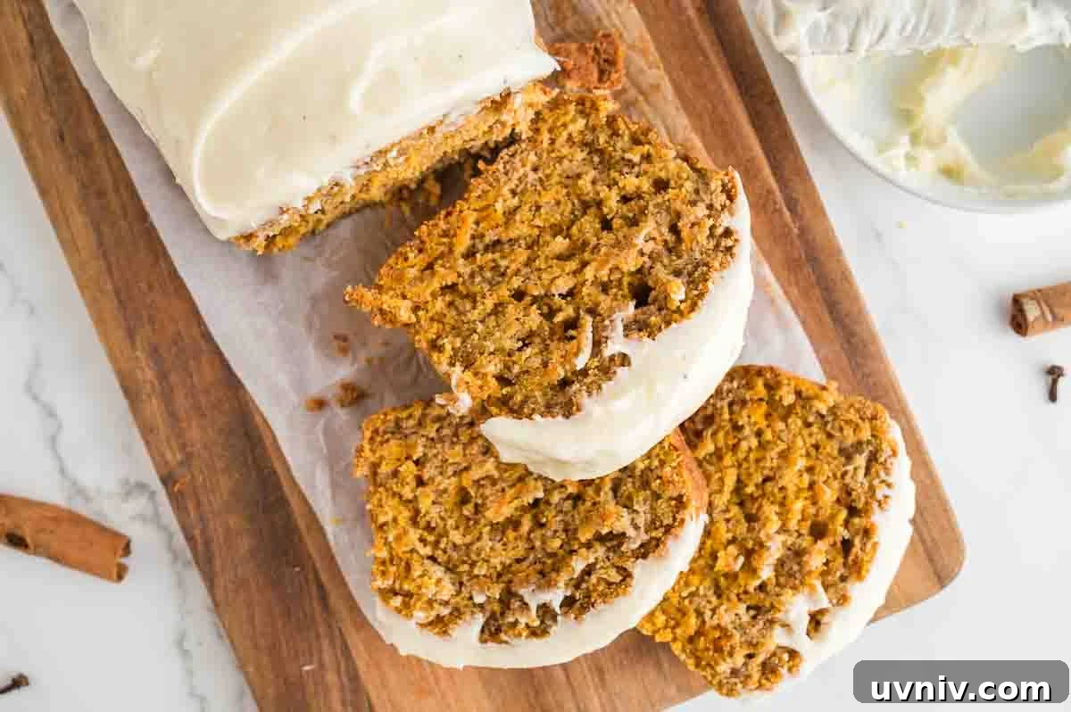 Moist Carrot Cake Loaf with Cream Cheese Glaze 13 An overhead image of carrot cake loaf slices.