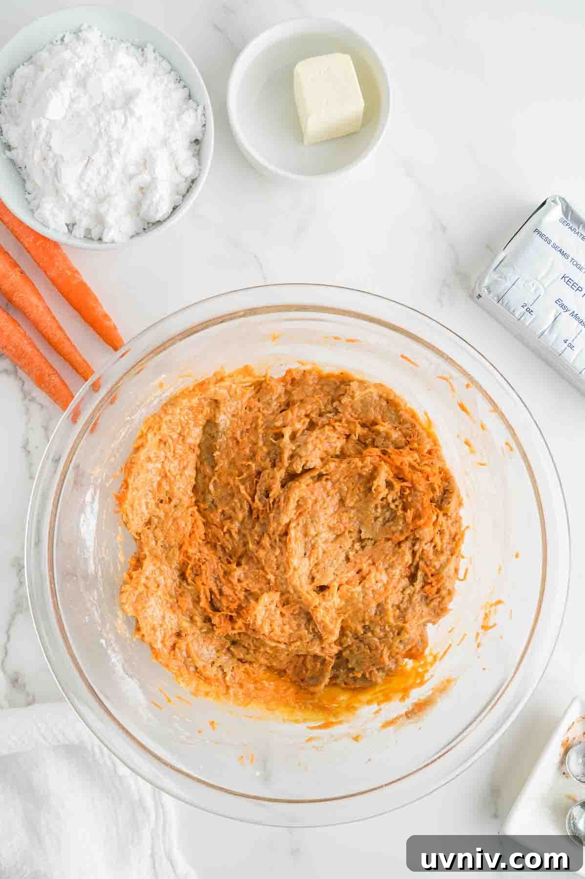 Moist Carrot Cake Loaf with Cream Cheese Glaze 7 An overhead image of the carrot cake loaf batter in a bowl.
