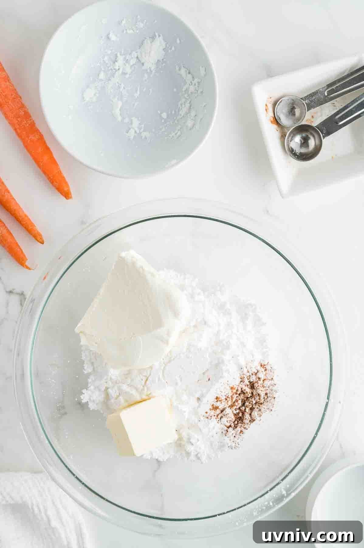 Moist Carrot Cake Loaf with Cream Cheese Glaze 10 An overhead image of combining the frosting ingredients together.