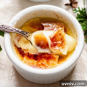 Eggnog Crème Brûlée Recipe: Silky Custard with Caramelized Top 14 Spoon scooping out eggnog creme brulee