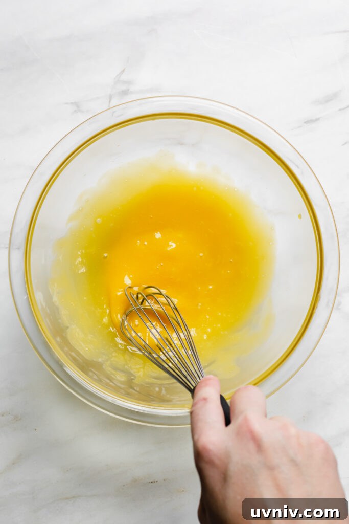 Eggnog Crème Brûlée Recipe: Silky Custard with Caramelized Top 4 Whisking yolks
