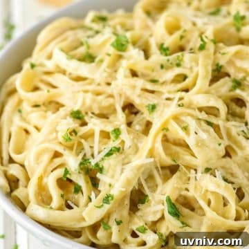 Fettuccine with alfredo sauce in bowl.