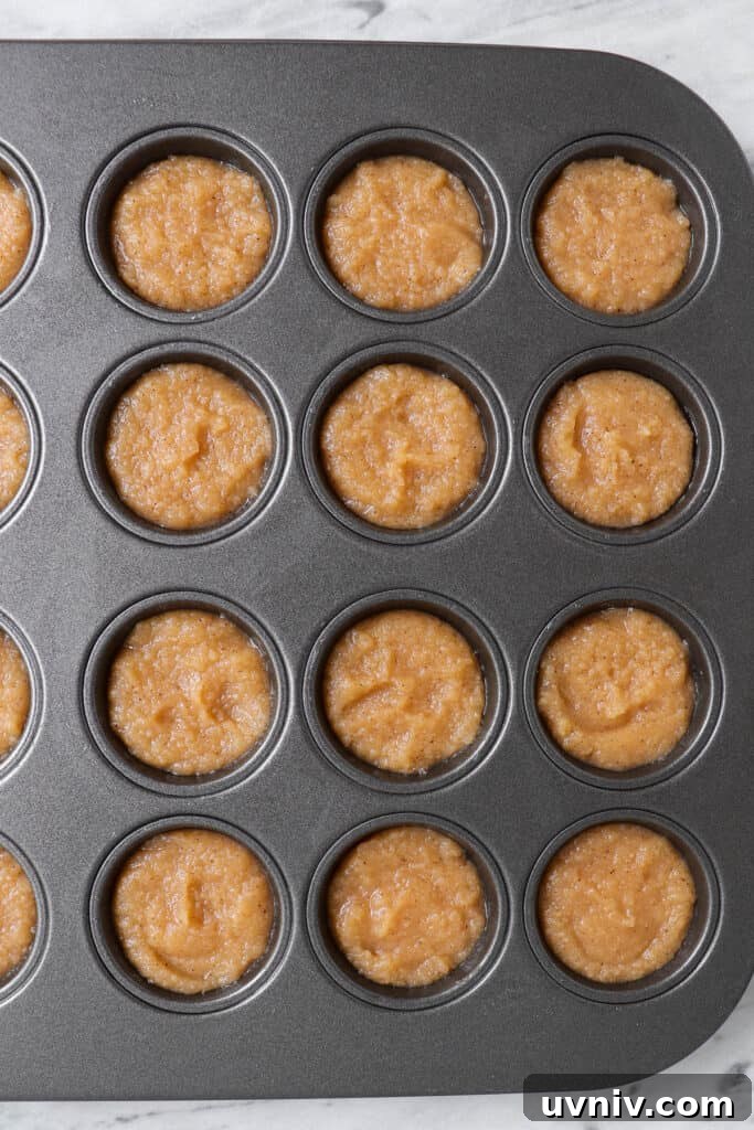 Paleo Apple Cinnamon Donut Holes Recipe — Gluten-Free Bites 6 Uncooked batter in mini muffin pan before baking