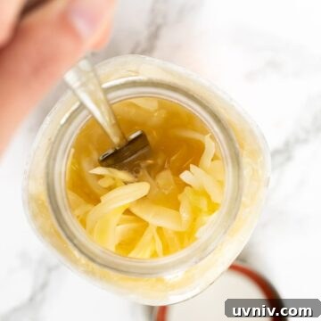 a top down view of sauerkraut in a mason jar.