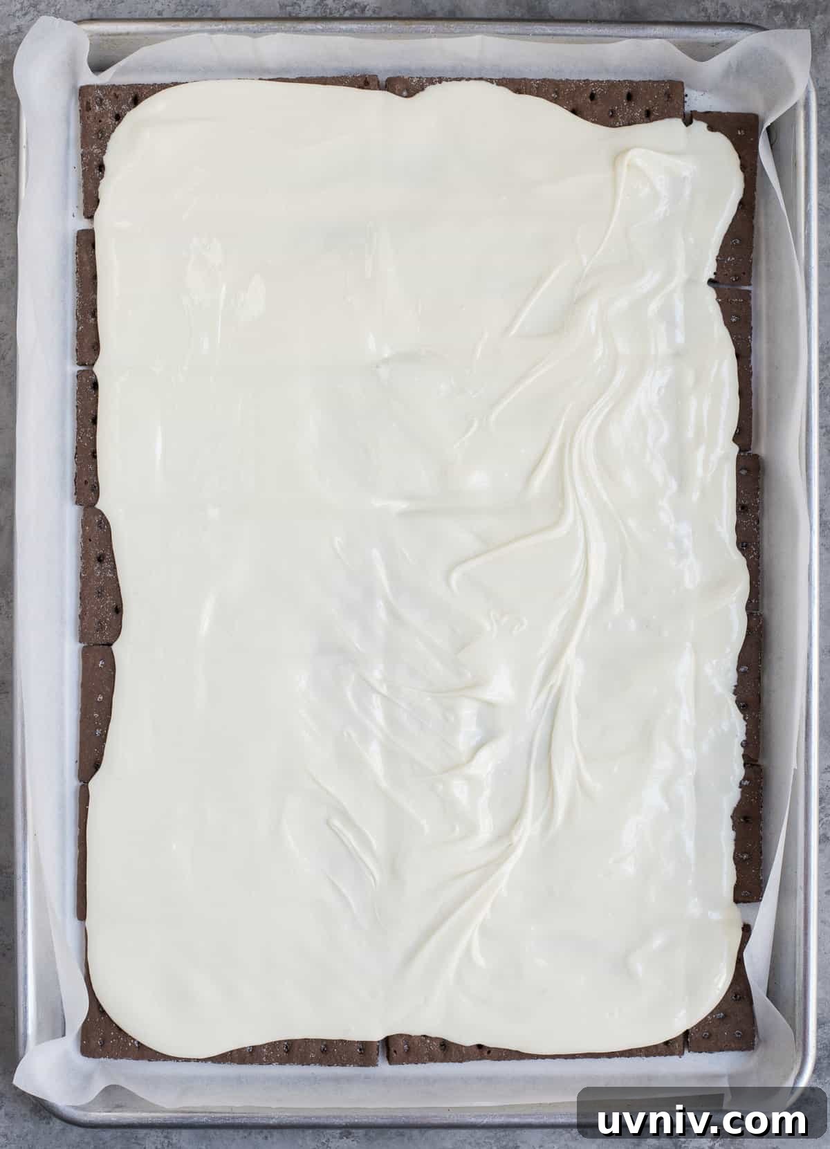 Chocolate Peppermint Bark Recipe for Holidays & Gift Giving 6 melted white chocolate spread over chocolate graham crackers