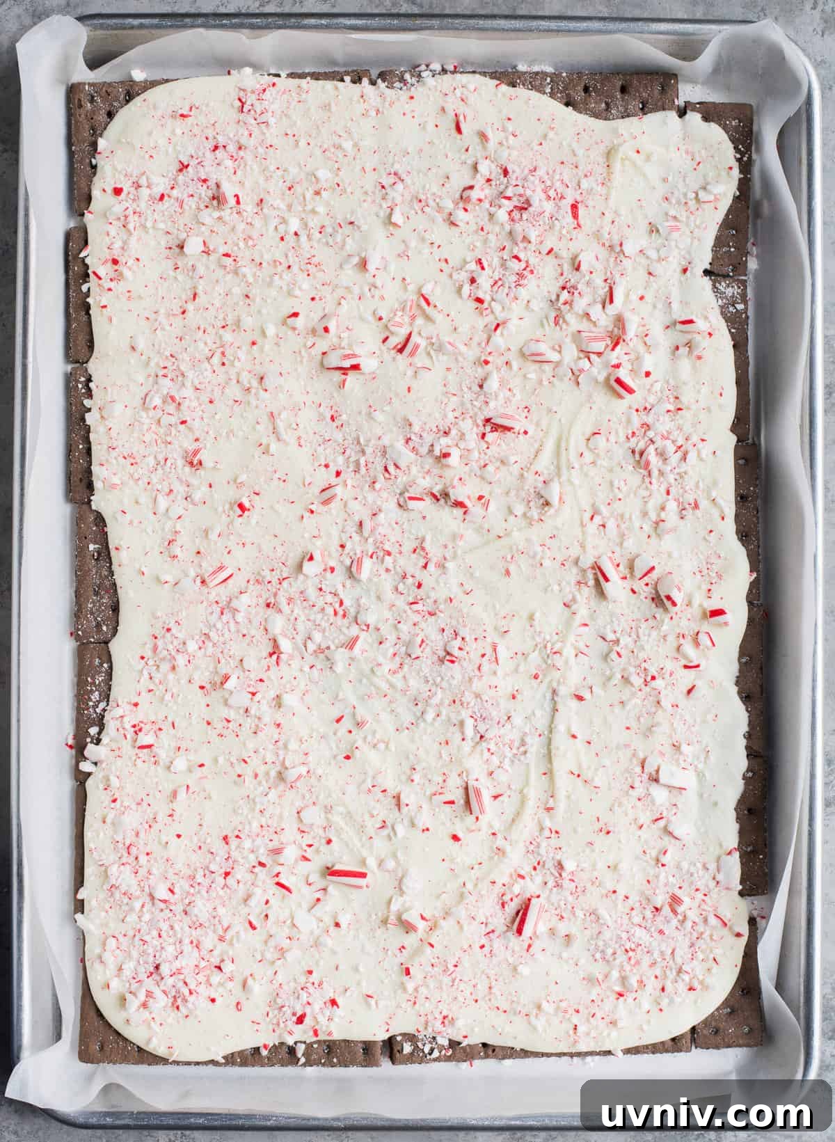 Chocolate Peppermint Bark Recipe for Holidays & Gift Giving 7 melted white chocolate and crushed candy canes spread over chocolate graham crackers