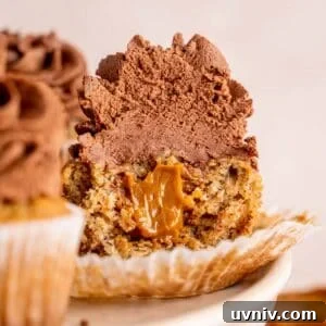Banoffee Cupcakes Recipe: Caramel Banana Cupcakes with Toffee Frosting 17 Half of a banoffee cupcake showing the dulce de leche on the inside.