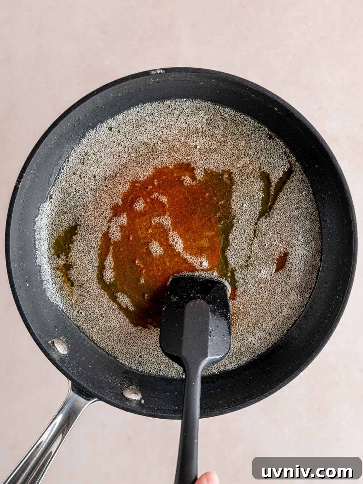 Banoffee Cupcakes Recipe: Caramel Banana Cupcakes with Toffee Frosting 4 Browned butter in a skillet with a spatula.