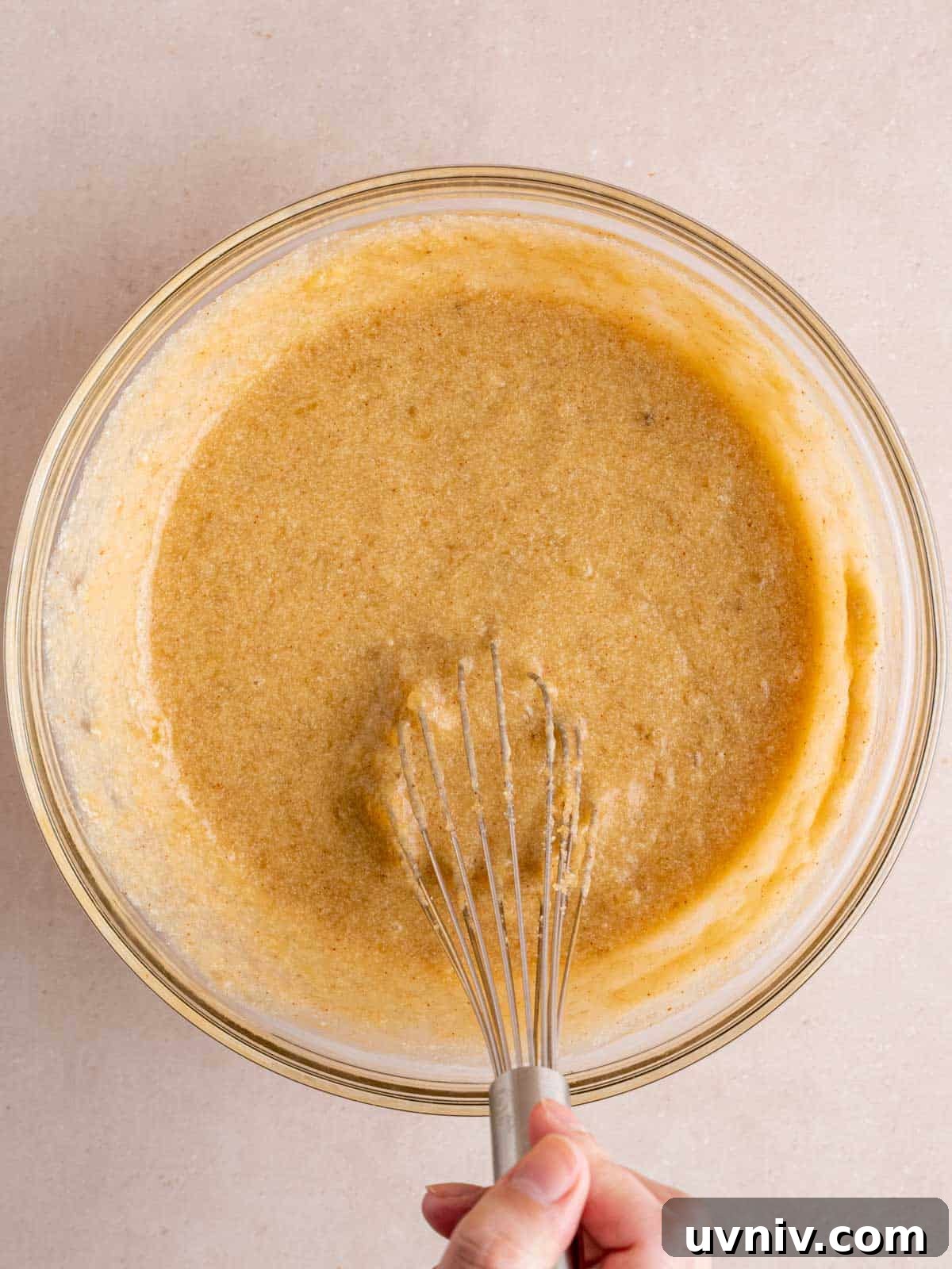 Banoffee Cupcakes Recipe: Caramel Banana Cupcakes with Toffee Frosting 6 Whisking brown butter, sugars, eggs, vanilla extract, sour cream, and mashed bananas in a bowl.