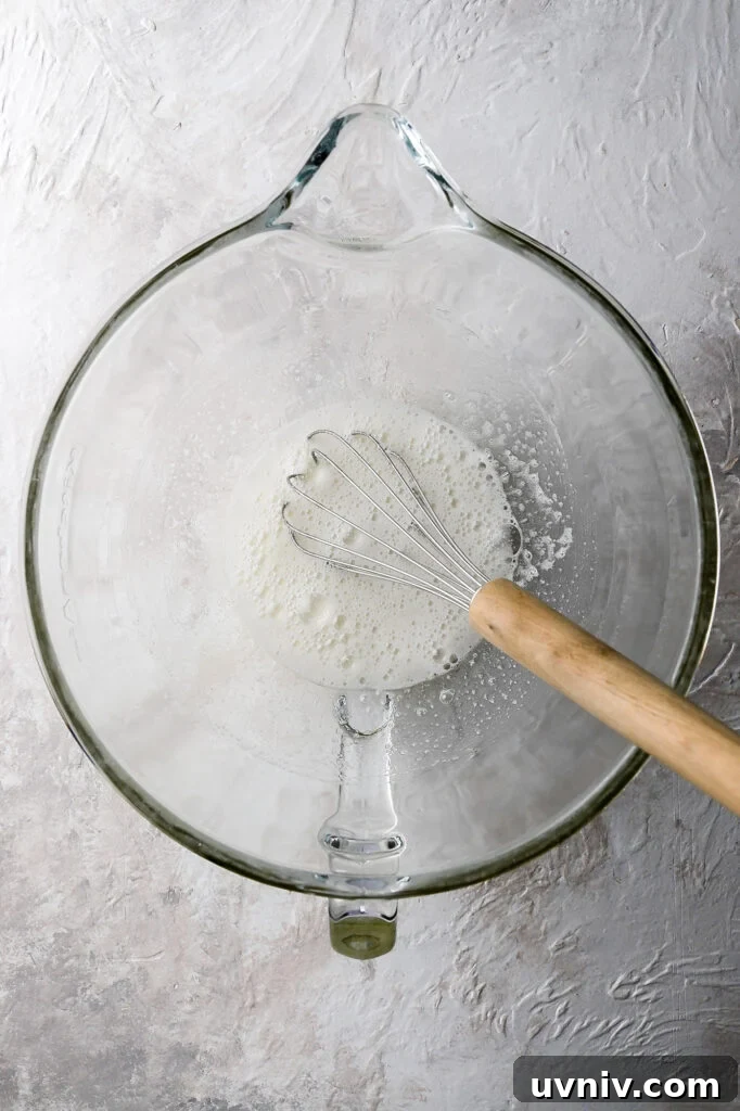 Party-Size Vanilla Birthday Sheet Cake Recipe 11 cooked egg whites and sugar looking frothy