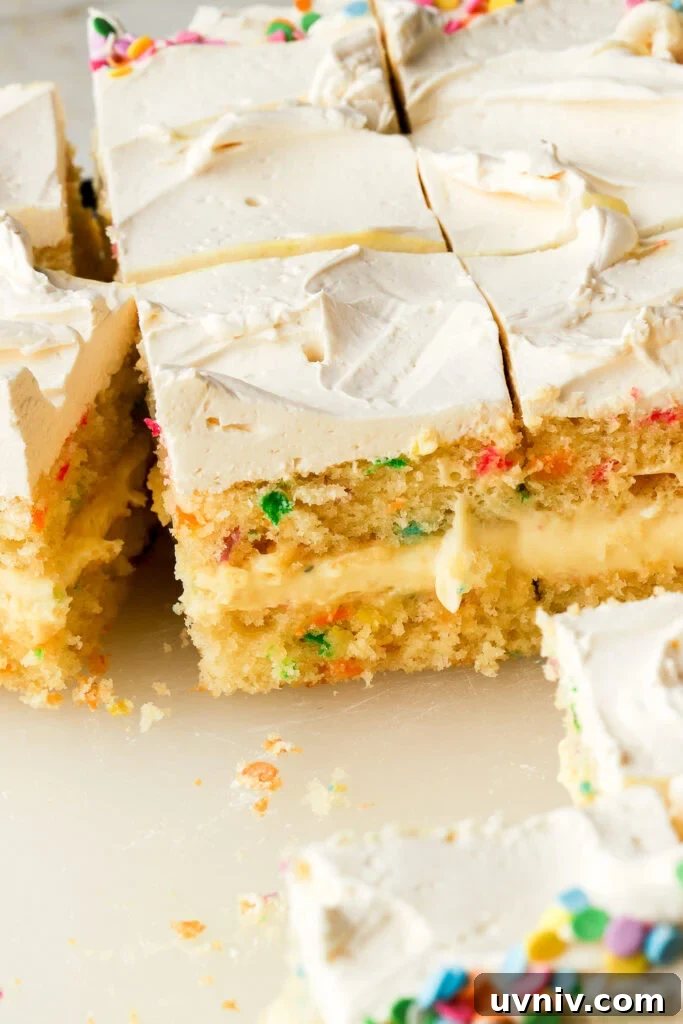 Party-Size Vanilla Birthday Sheet Cake Recipe 19 birthday cake on a board with slices cut to show the inside