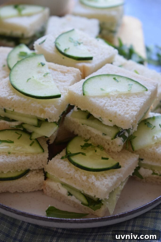 Close up of cucumber sandwiches on a plate.