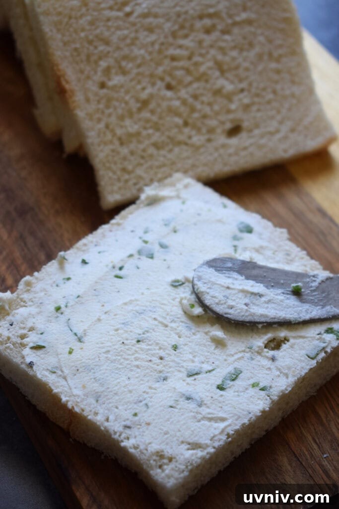 Spreading mascarpone cheese on bread.