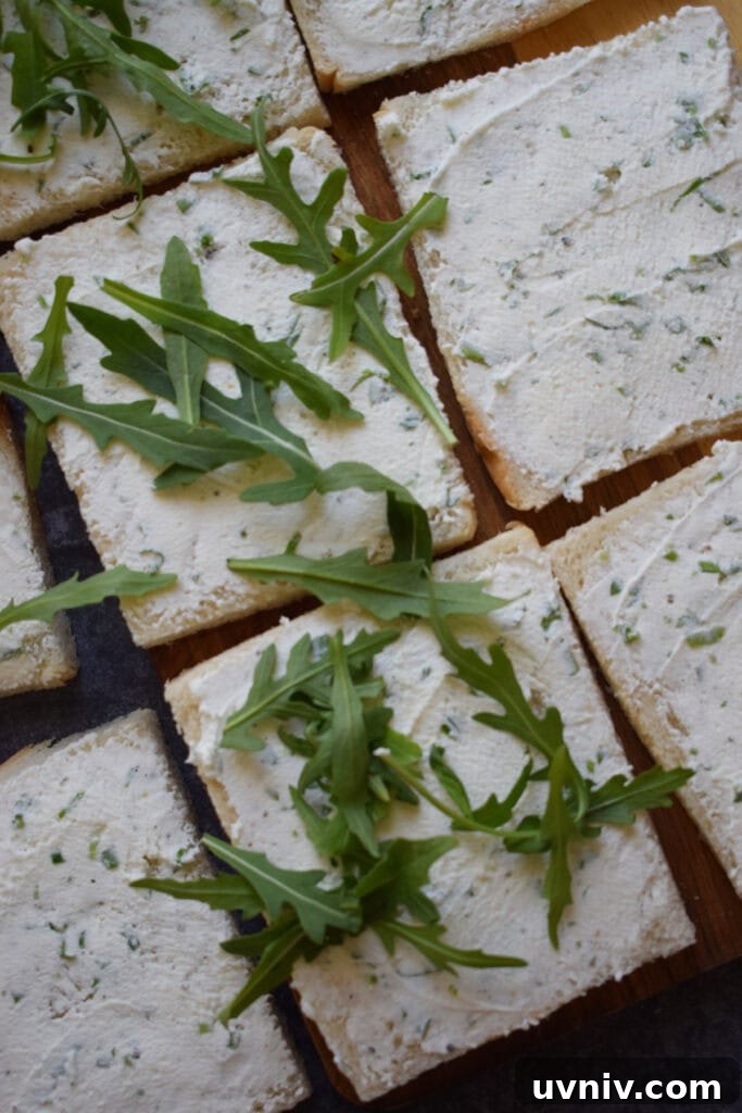 Arugula on bread slices.