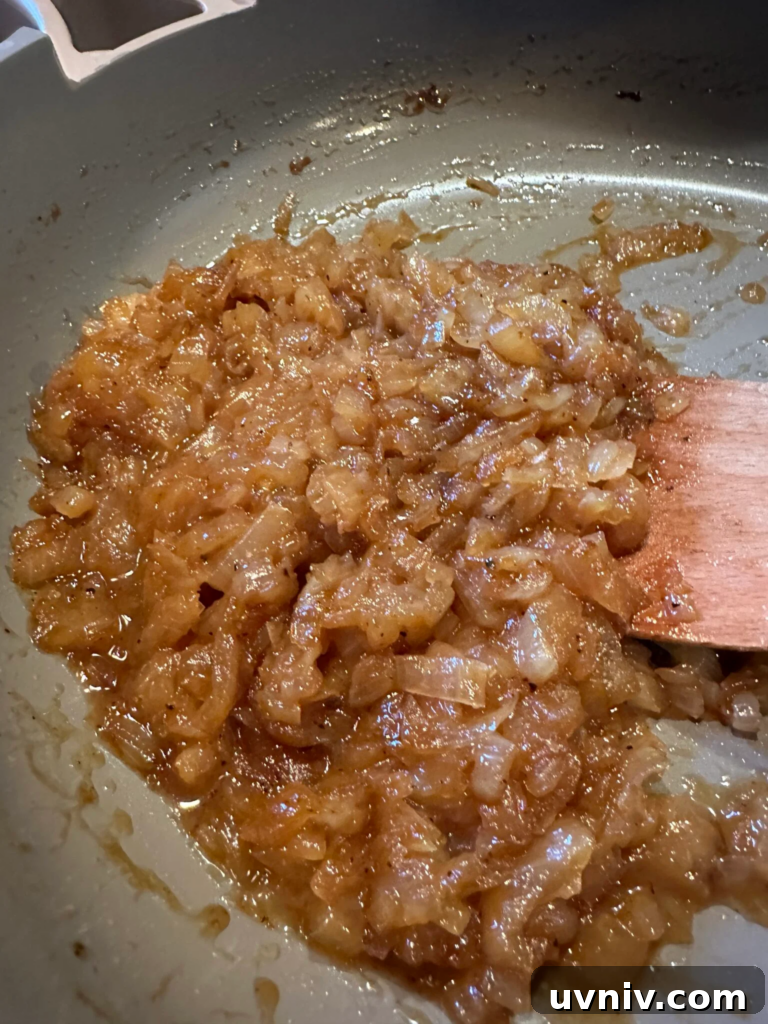 Smash Burger Sloppy Joes Recipe — Crispy Beef Sloppy Joe Sandwiches 5 Onions cooking in the pan