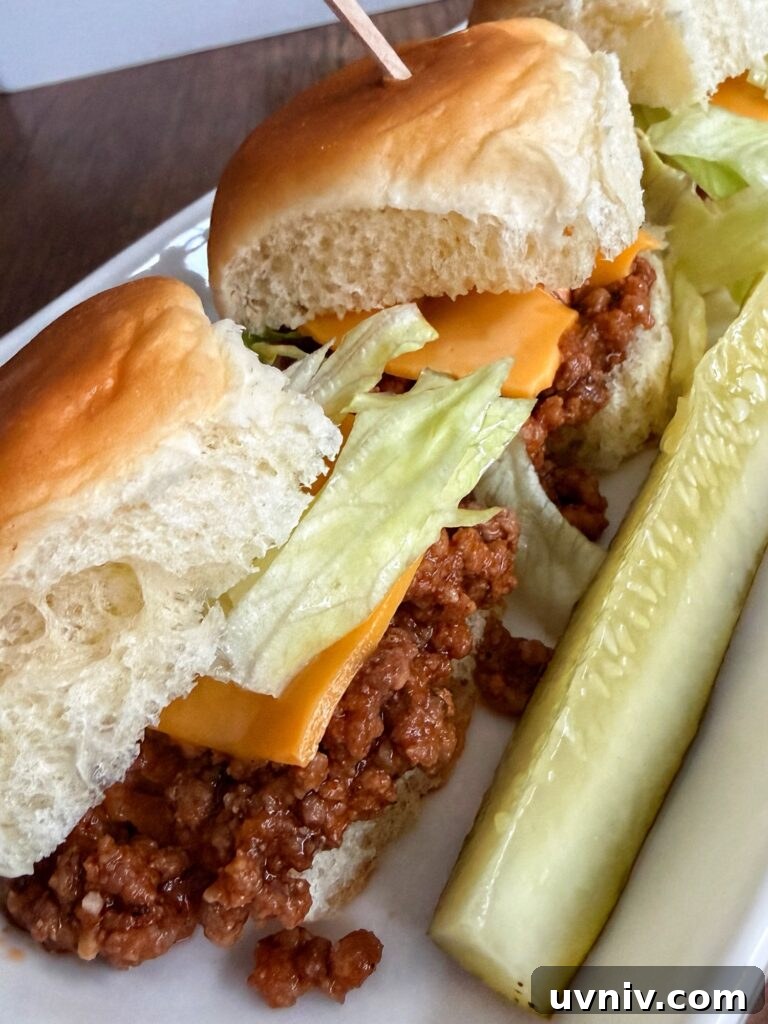 Smash Burger Sloppy Joes Recipe — Crispy Beef Sloppy Joe Sandwiches 8 A close up of the finished sloppy joes with a pickle