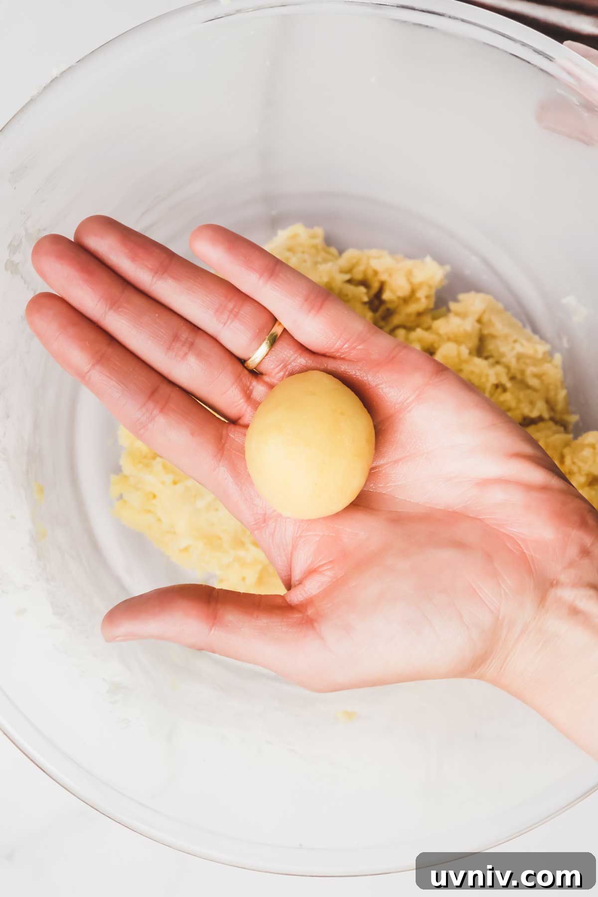 Homemade Vanilla Cake Pops Recipe: Step-by-Step Guide 6 Rolling a cake pop dough ball by hand
