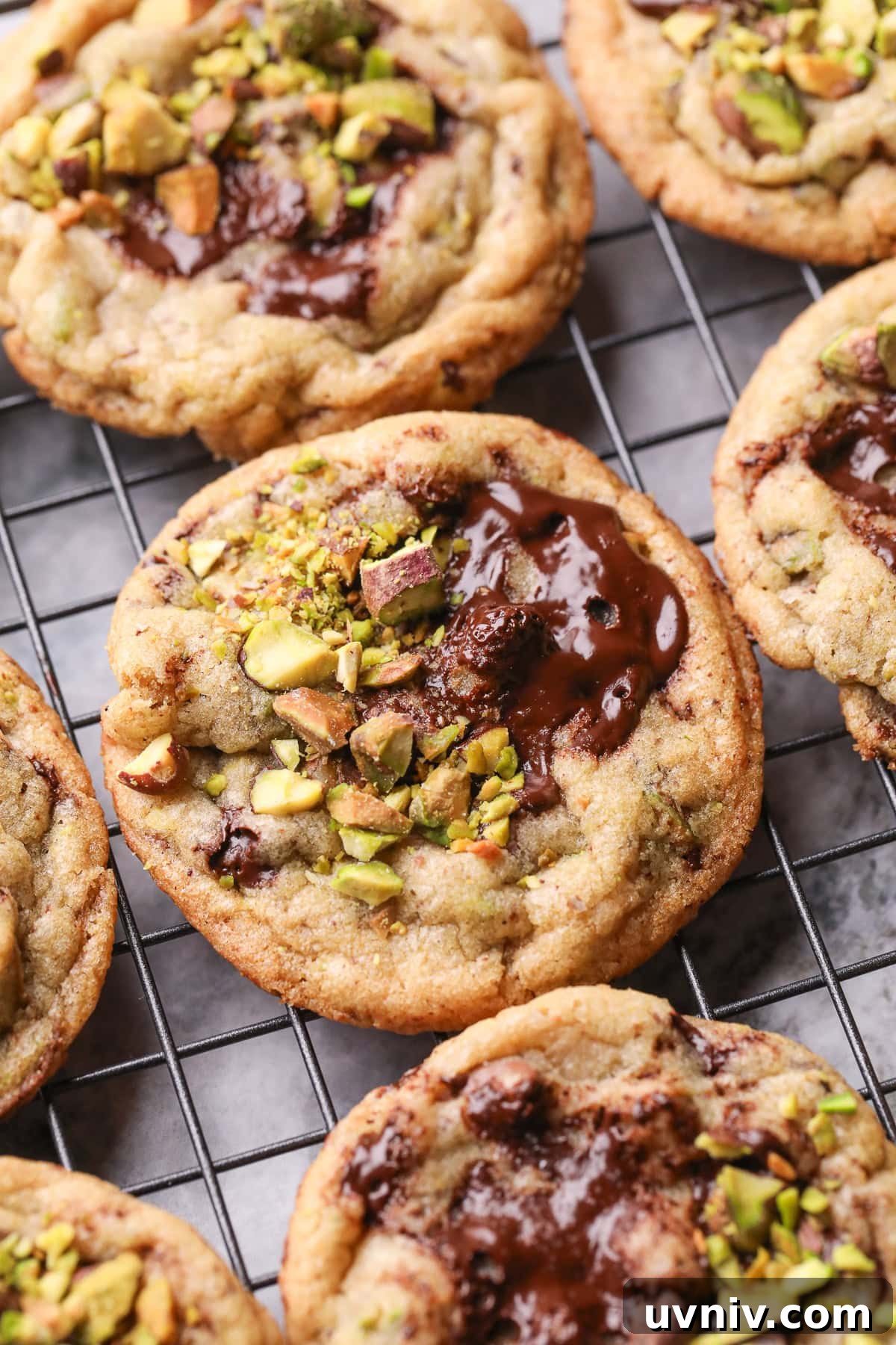 Brown Butter Pistachio Chocolate Chip Cookies Recipe 2 Brown butter pistachio chocolate chip cookies on a baking sheet.