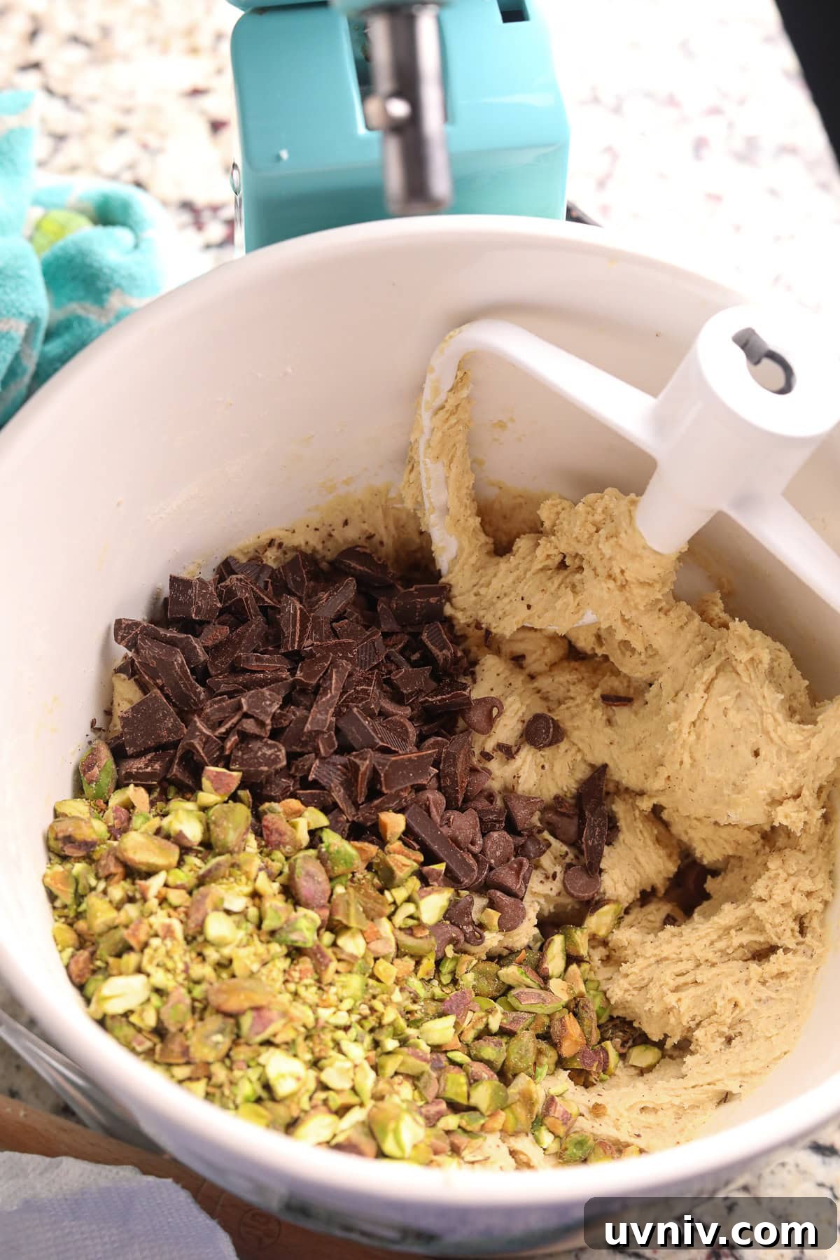Brown Butter Pistachio Chocolate Chip Cookies Recipe 7 Brown butter pistachio chocolate chip cookie dough in a mixing bowl.