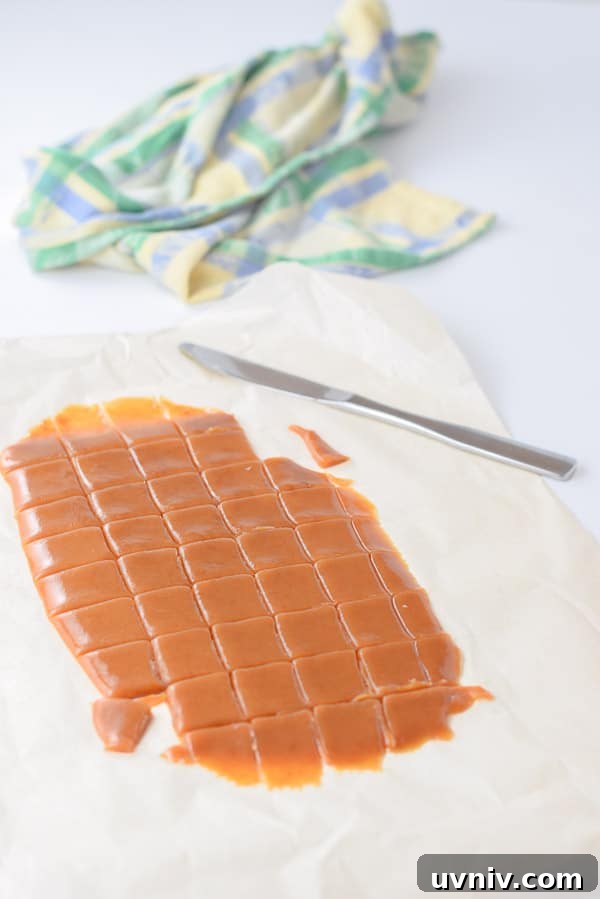 How to Make Soft, Chewy Caramels at Home 7 caramel poured on parchment paper and cut
