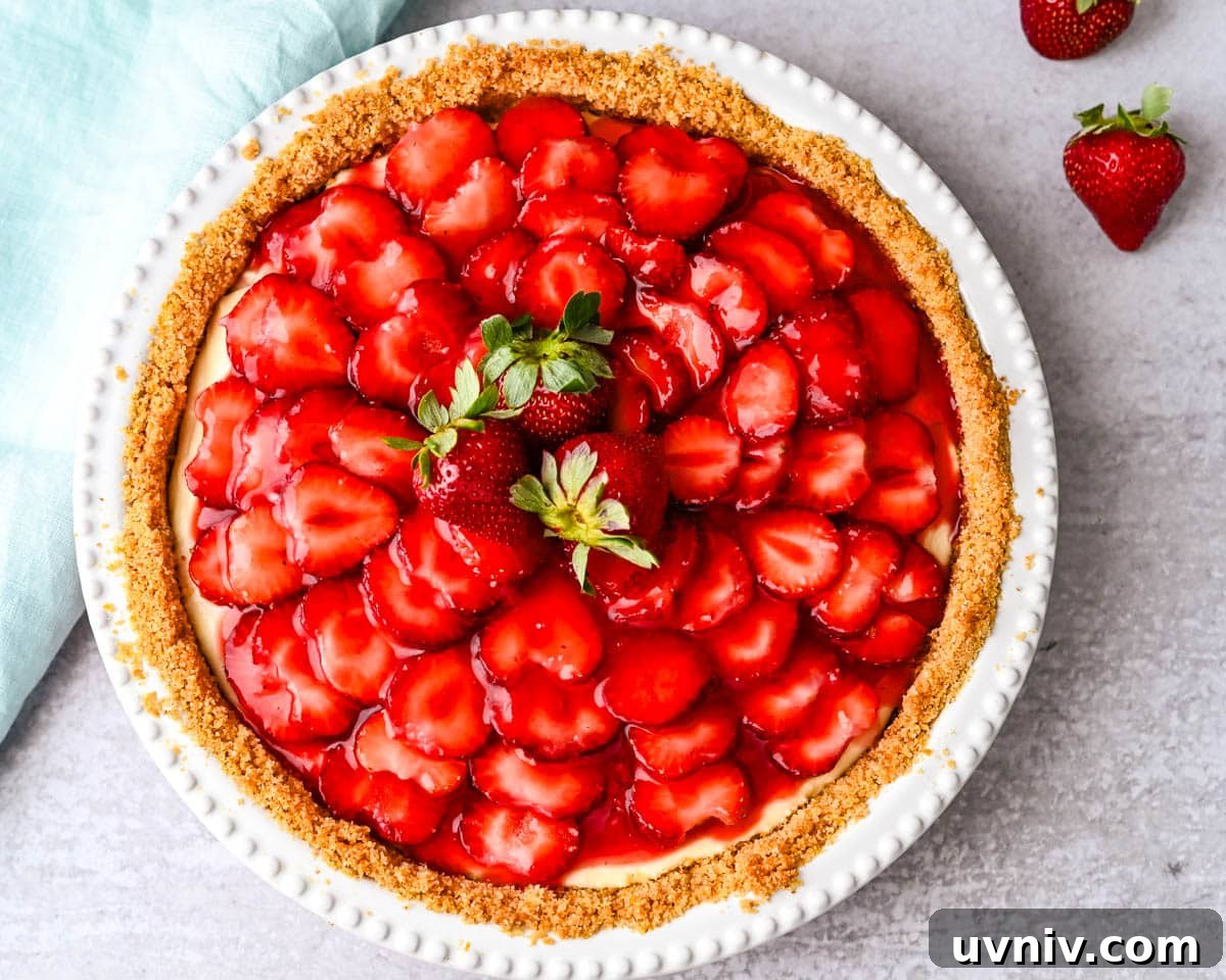 A whole Strawberry Ricotta pie with graham cracker crust.
