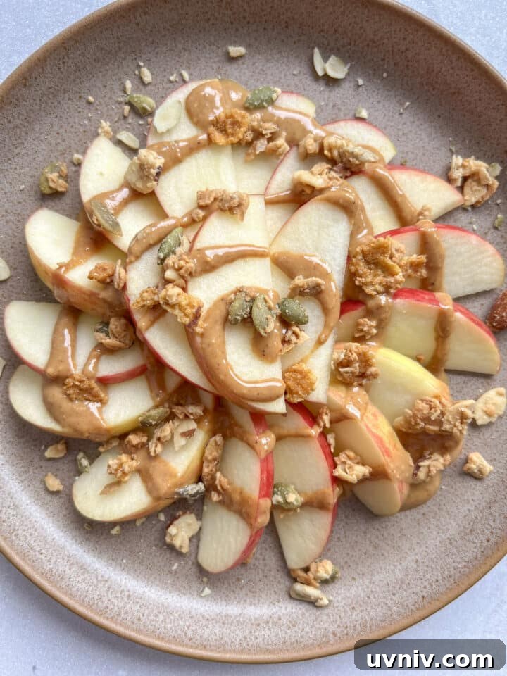 3-Ingredient Apple Nachos Recipe: Quick Sweet Snack 3 plate of apple nachos topped with peanut butter and granola