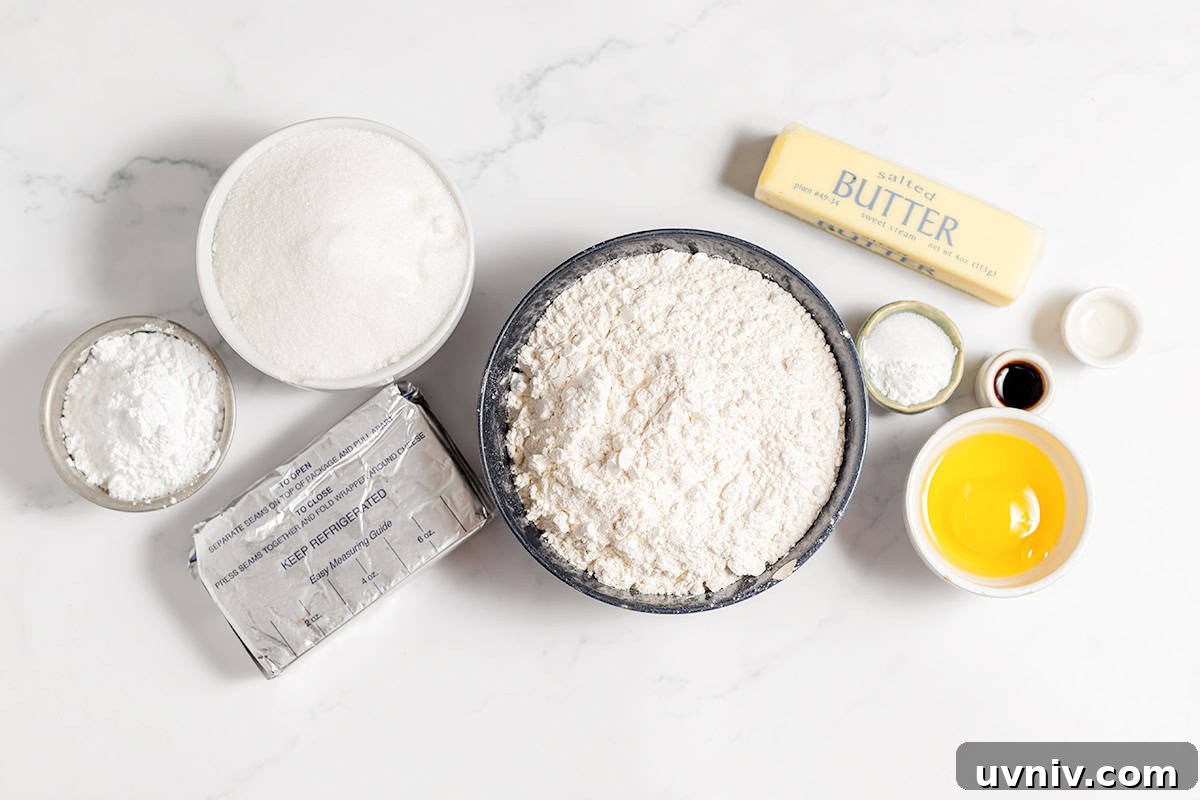 Baking ingredients like flour, sugar, butter, eggs, vanilla extract, baking powder, and salt are arranged on a white surface—perfect for whipping up a batch of gooey butter cookies.
