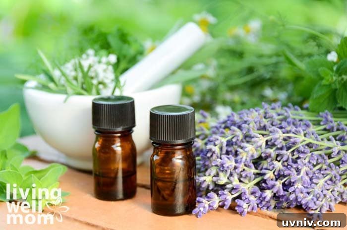 two small essential oil dropper bottles next to lavender blooms
