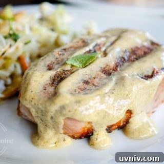 grilled pork chops topped with a sage mustard cream sauce