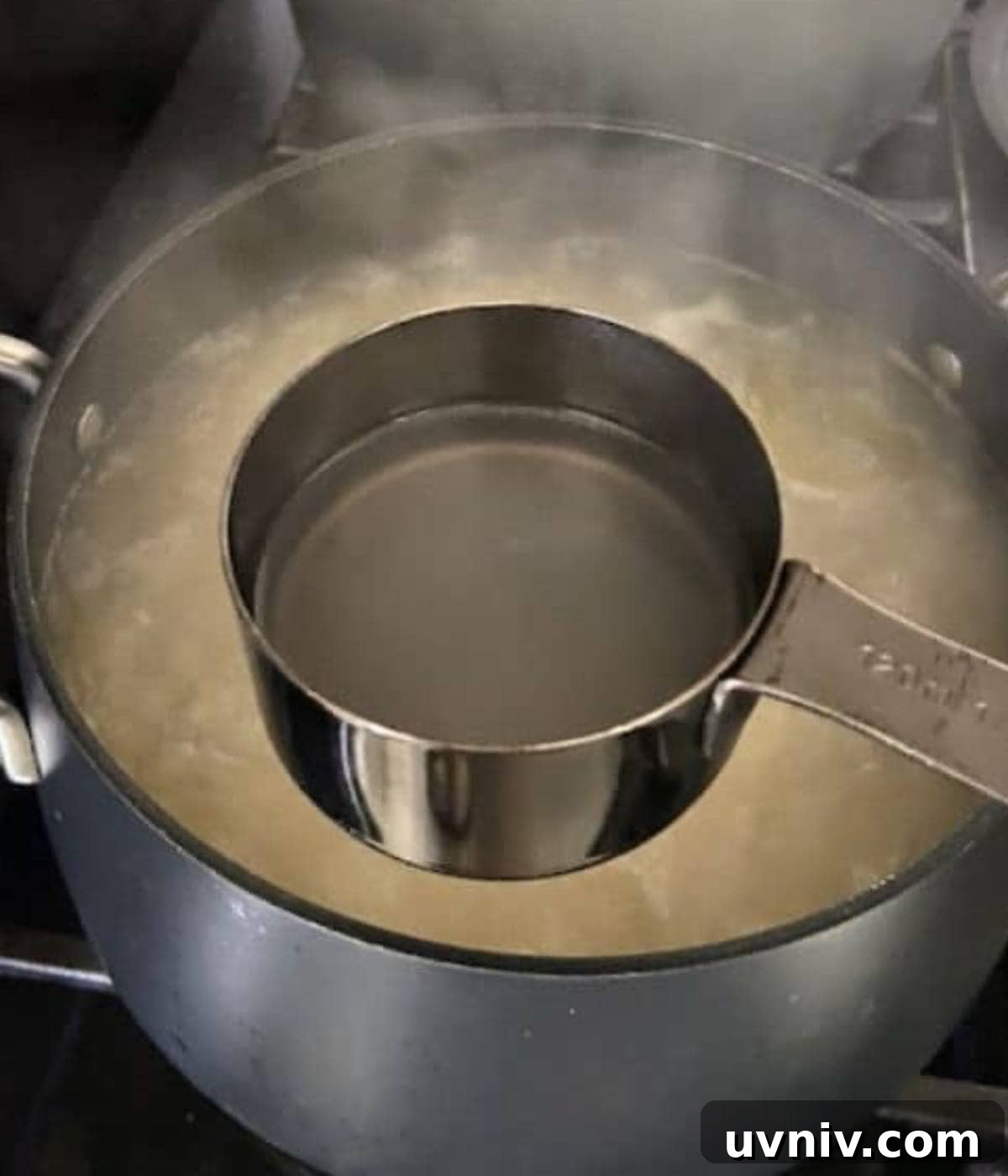 Reserving pasta water from boiling pot.