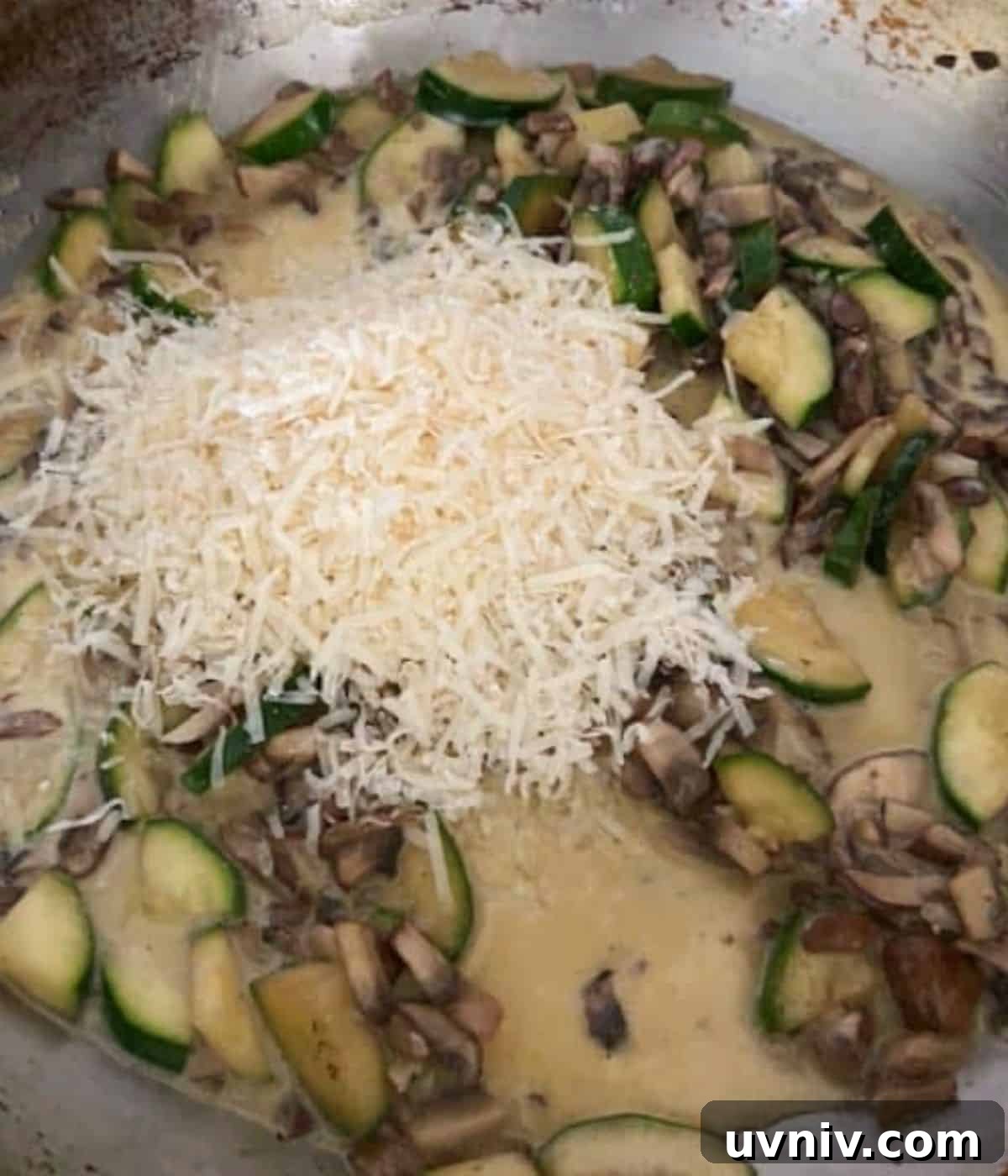 Parmesan Cheese over mushrooms and zucchini.