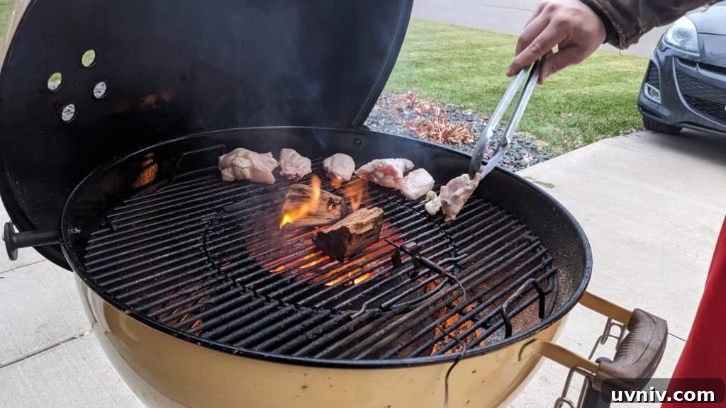 chicken wings going on the Weber kettle grill chicken wings going on the Weber kettle grill