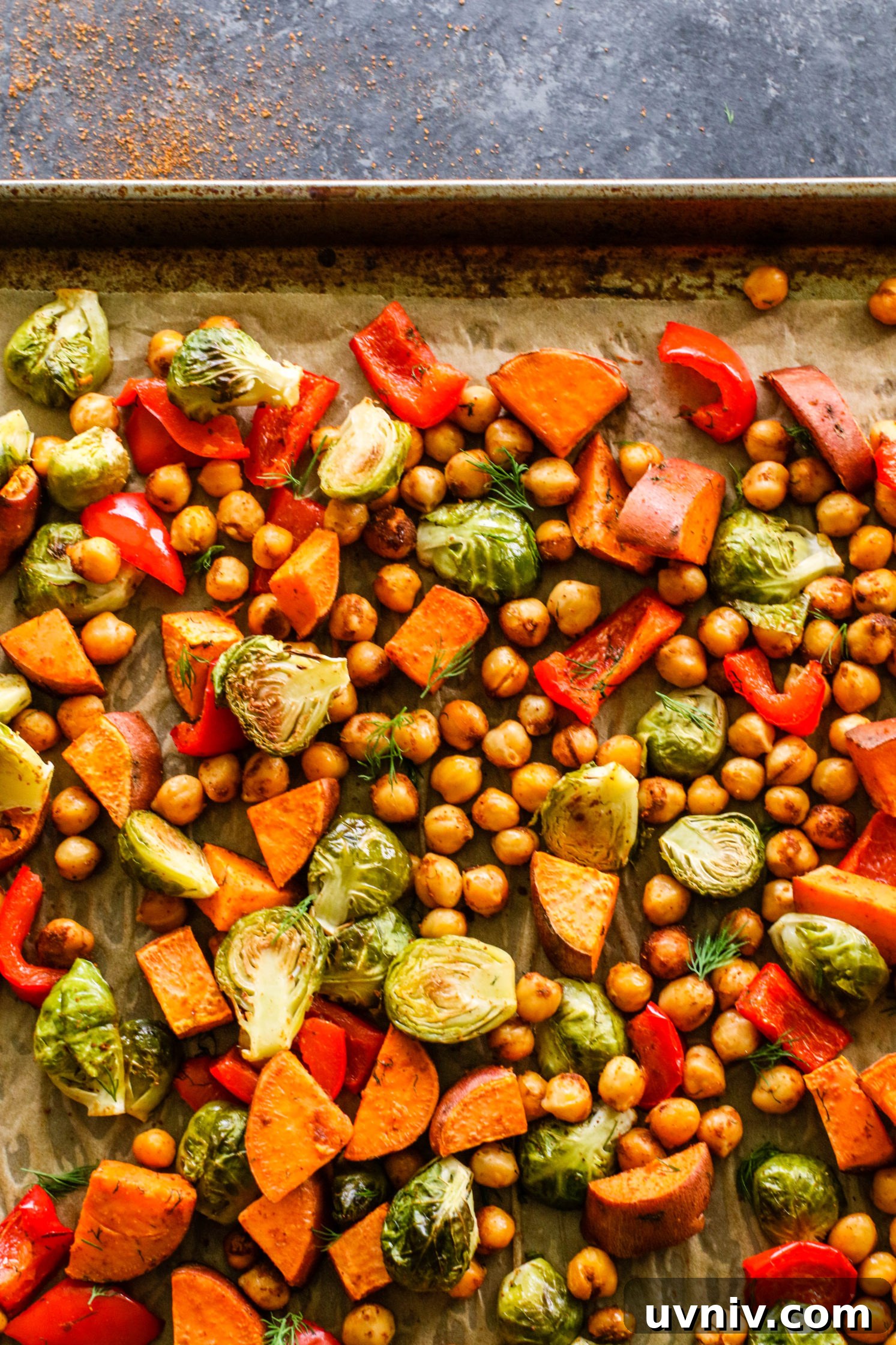 Sweet Potato & Chickpea Bake baked on parchment lined baking sheet by Flora & Vino