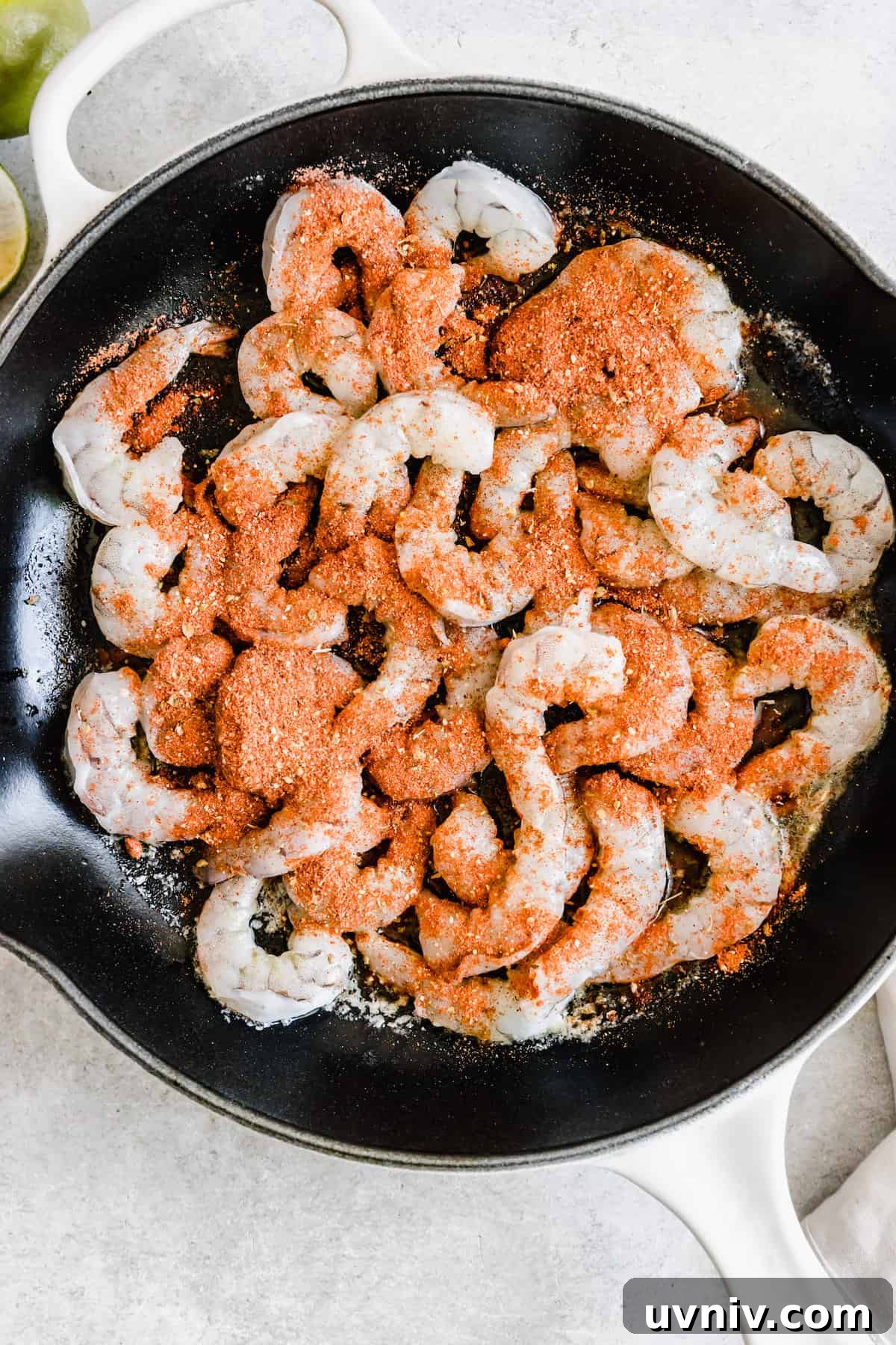Seasoned Shrimp Inside of a Metal Skillet