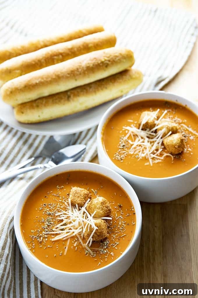 Slow Cooker Creamy Tomato Soup is a simple homemade tomato soup that is easy to make right in your crockpot! The absolute best tomato soup recipe bursting with rich, creamy, tomato flavor! tomato soup