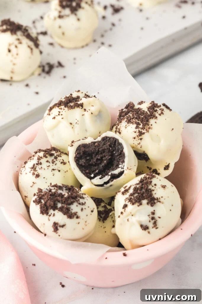 Decadent Oreo Truffles: Bite-Sized Chocolate Dessert Recipe 2 oreo truffles in bowl