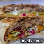 Crunchwrap Supreme with Pulled Pork: Copycat Recipe & Tips 13 pulled pork crunch wrap supreme cut in half
