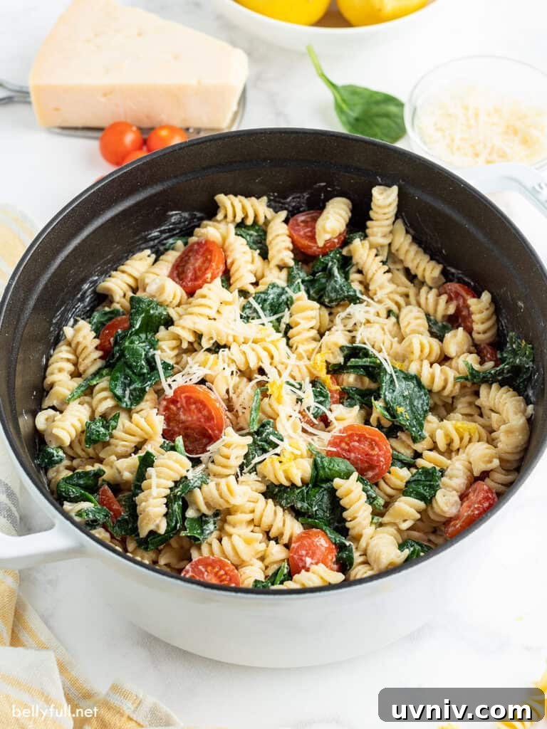Creamy Lemon Pasta Recipe with Garlic and Parmesan 2 Creamy Lemon Pasta with tomatoes and spinach in pot