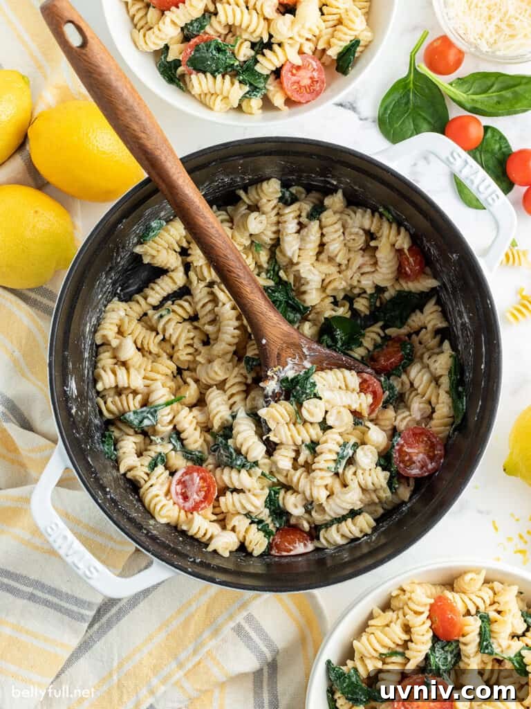 Creamy Lemon Pasta Recipe with Garlic and Parmesan 4 top down photo of lemon pasta in pot with wooden spoon