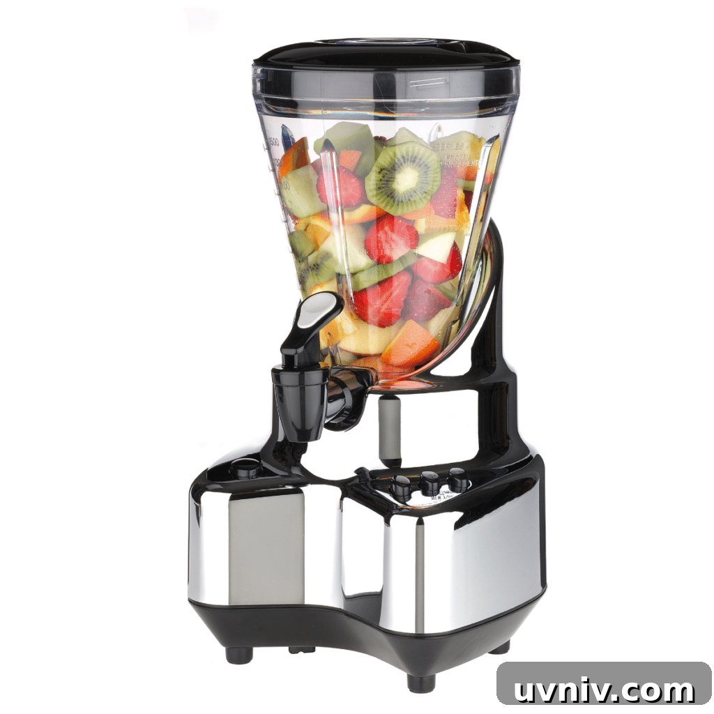 Electric smoothie blender full of cut fruit