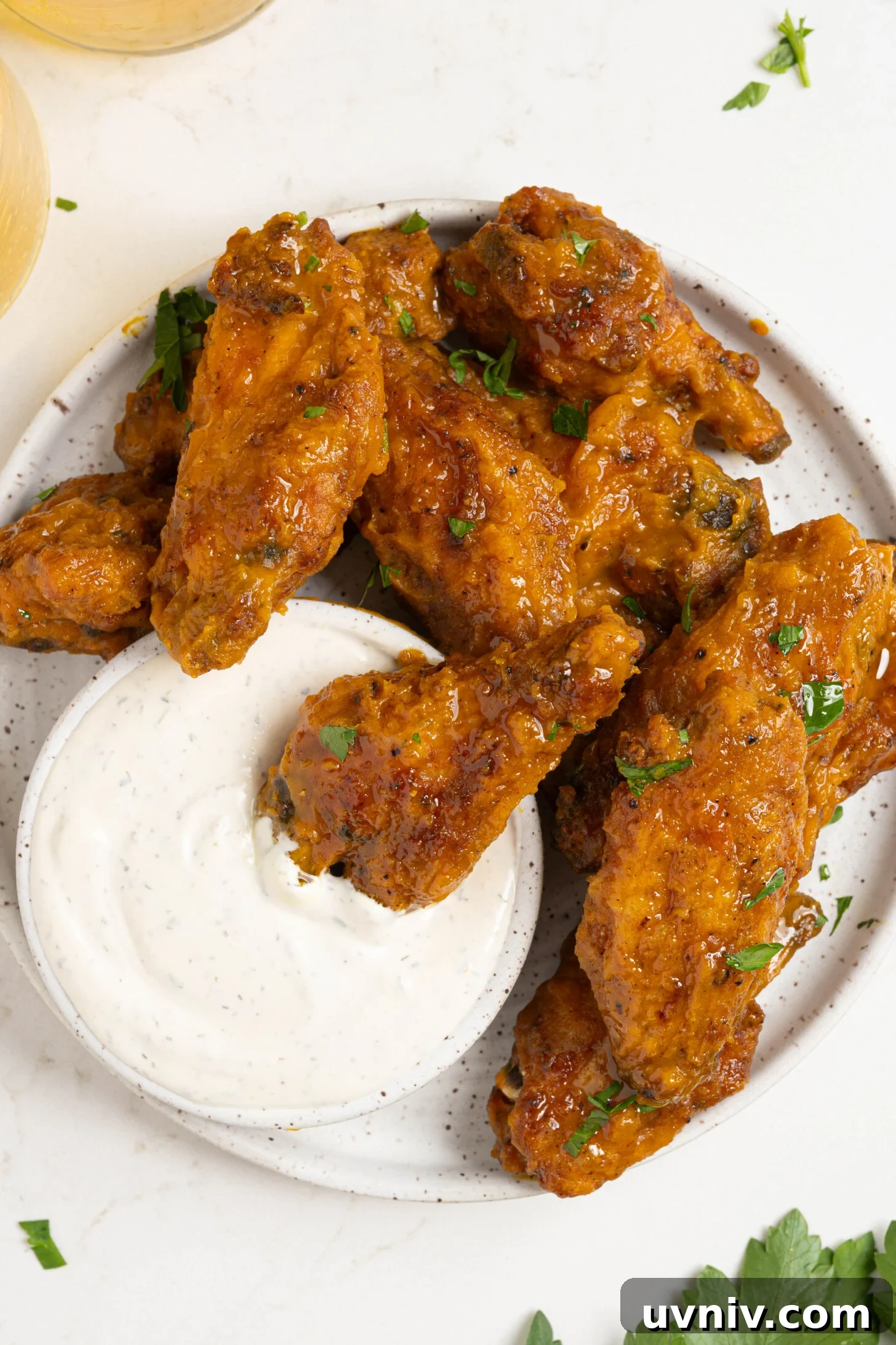 Mango Habanero Chicken Wings with Sticky Glaze 2 A plate of mango habanero wings.