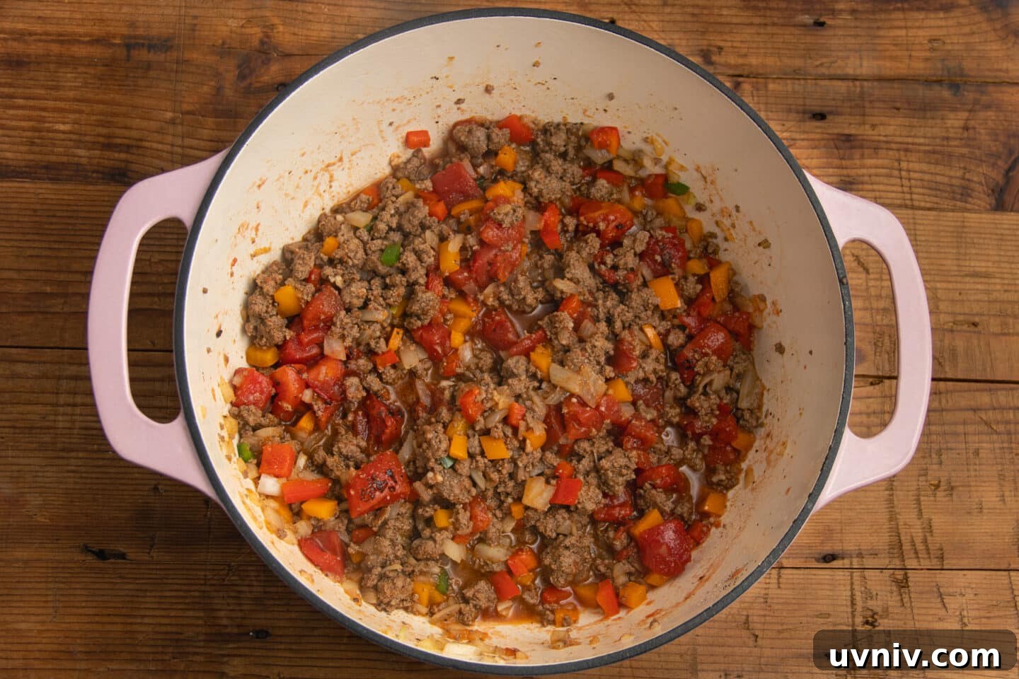 Creamy Beef Taco Soup Recipe — Comforting Weeknight Meal 6 This is a picture of the pot with tomatoes added to the veggies and the beef.