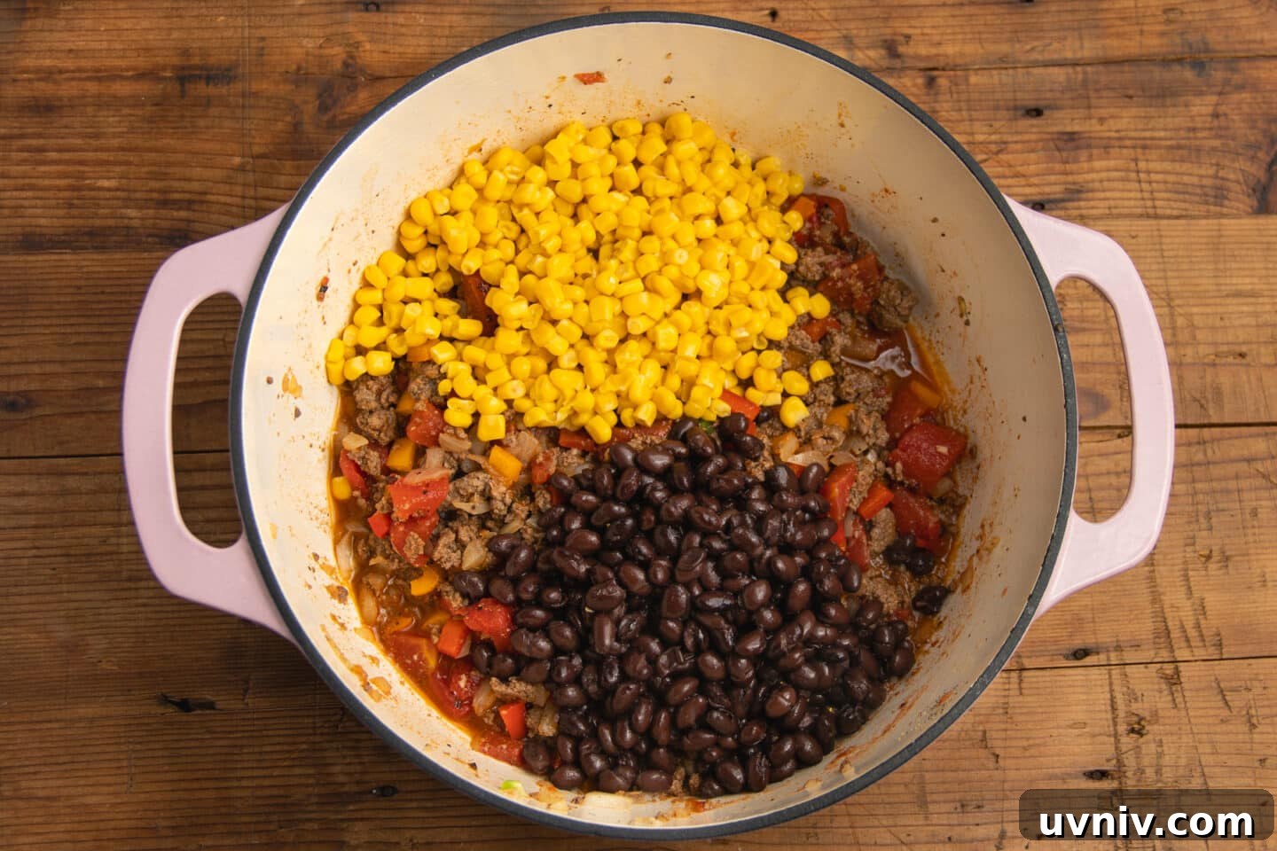 Creamy Beef Taco Soup Recipe — Comforting Weeknight Meal 7 This is a picture of the pot with the corn and beans added to the soup.