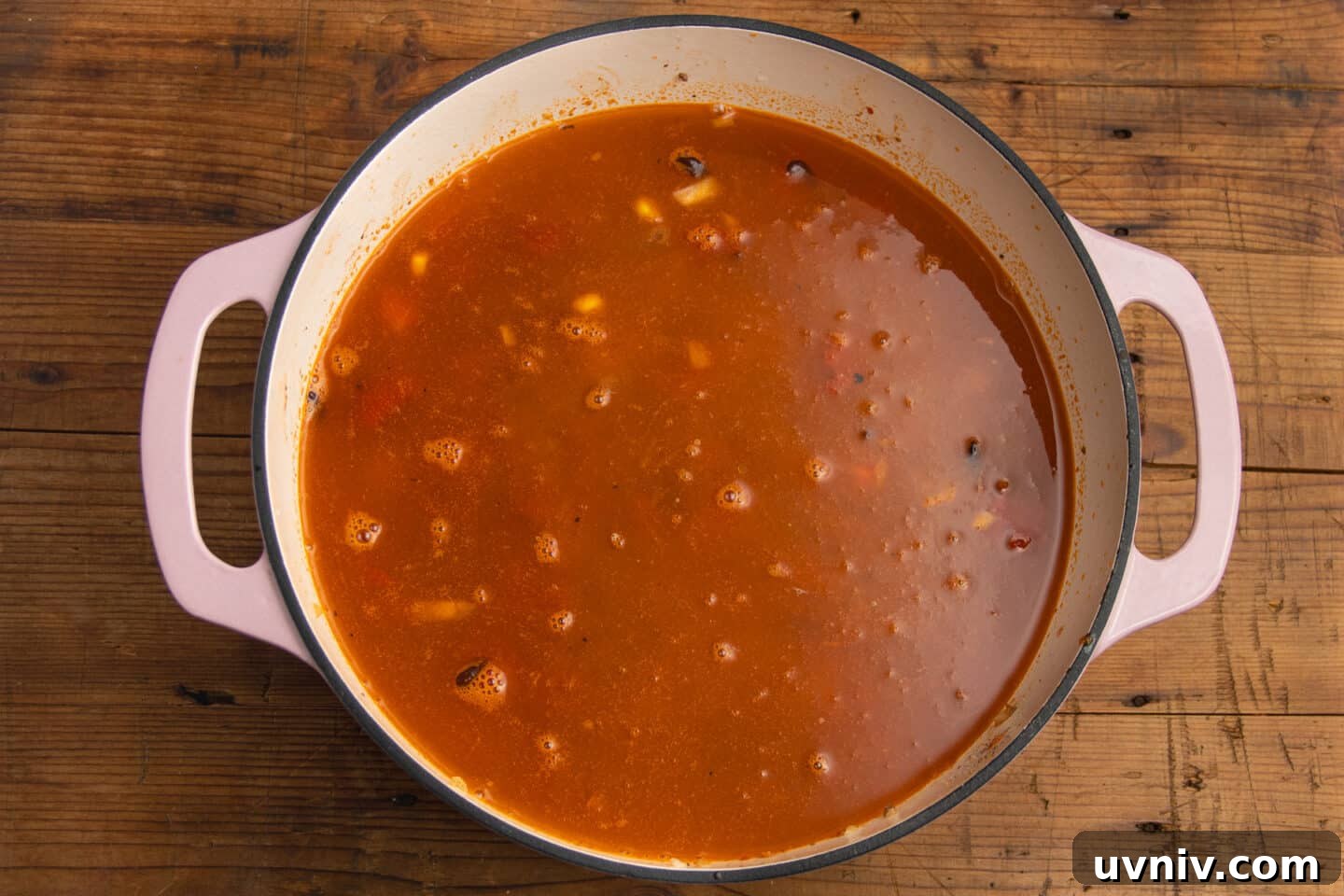 Creamy Beef Taco Soup Recipe — Comforting Weeknight Meal 8 This is a picture of the pot with the broth added to the soup.