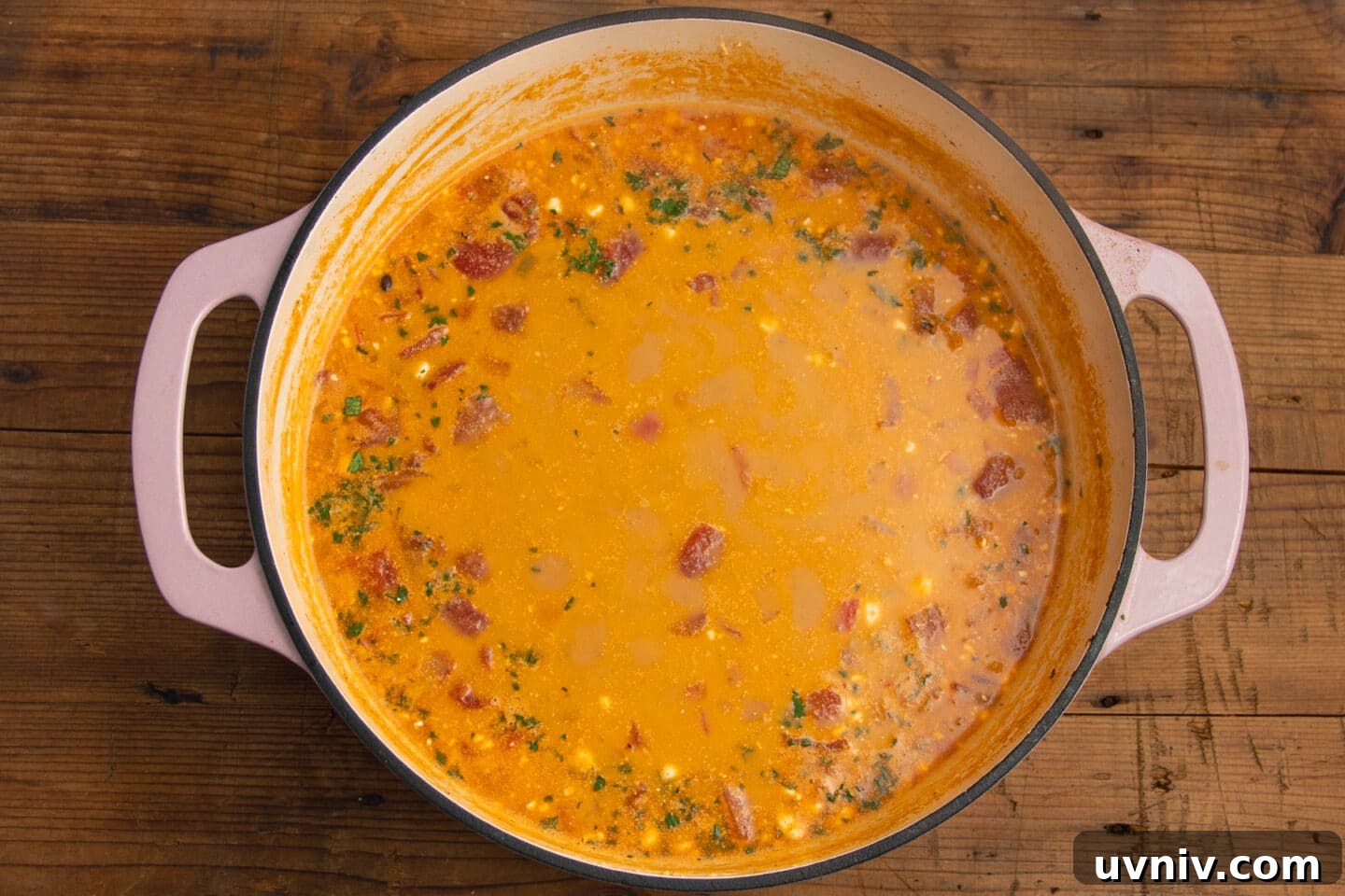 Creamy Beef Taco Soup Recipe — Comforting Weeknight Meal 9 This is a picture of the cream cheese and cheddar added and melted into the creamy beef taco soup.