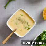 A small white bowl of preserved lemon vinaigrette topped with chopped parsley.