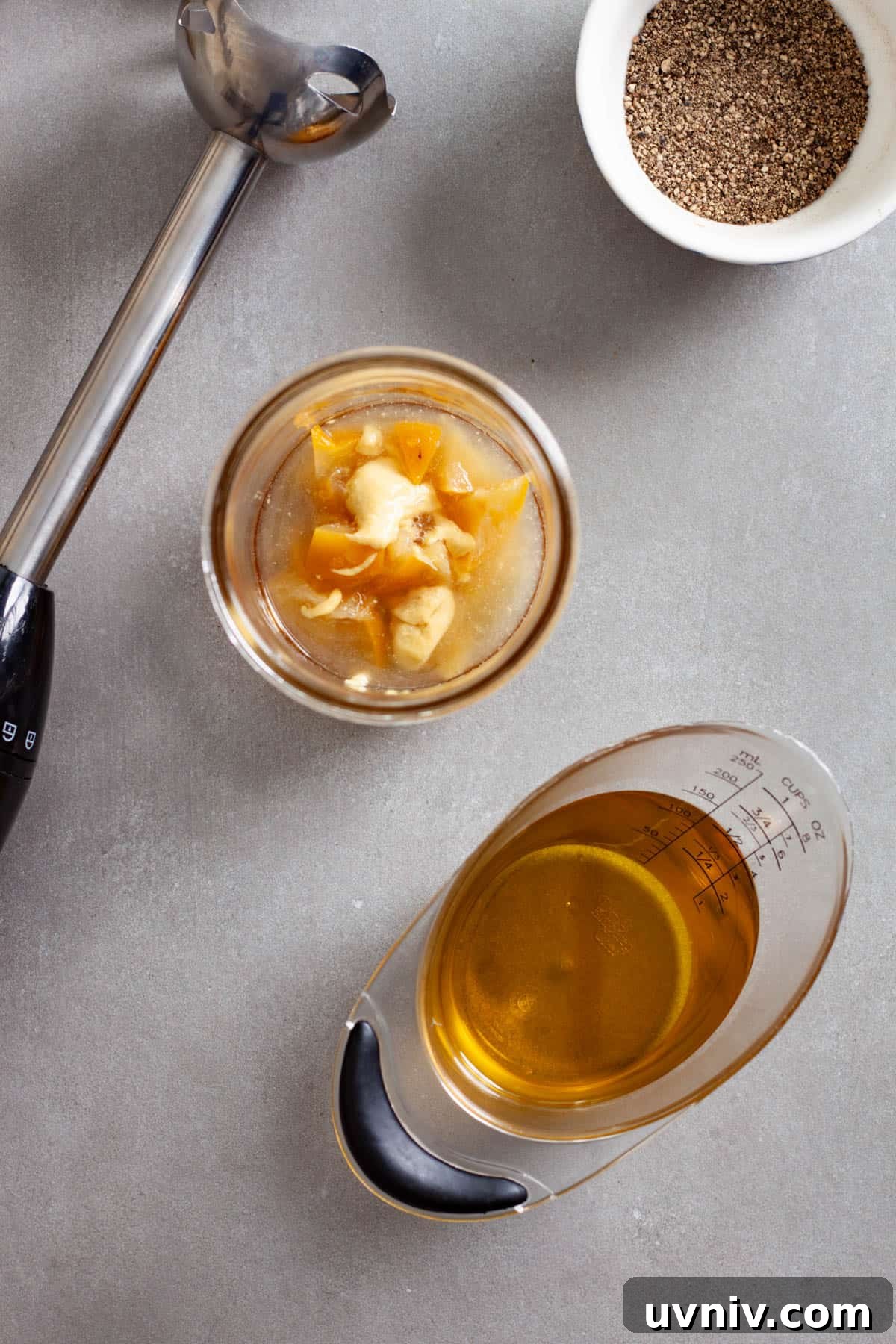 Zesty Preserved Lemon Vinaigrette Recipe for Salads & Marinades 4 Chopped preserved lemons, dijon mustard, lemon juice and maple syrup in a glass mason jar.
