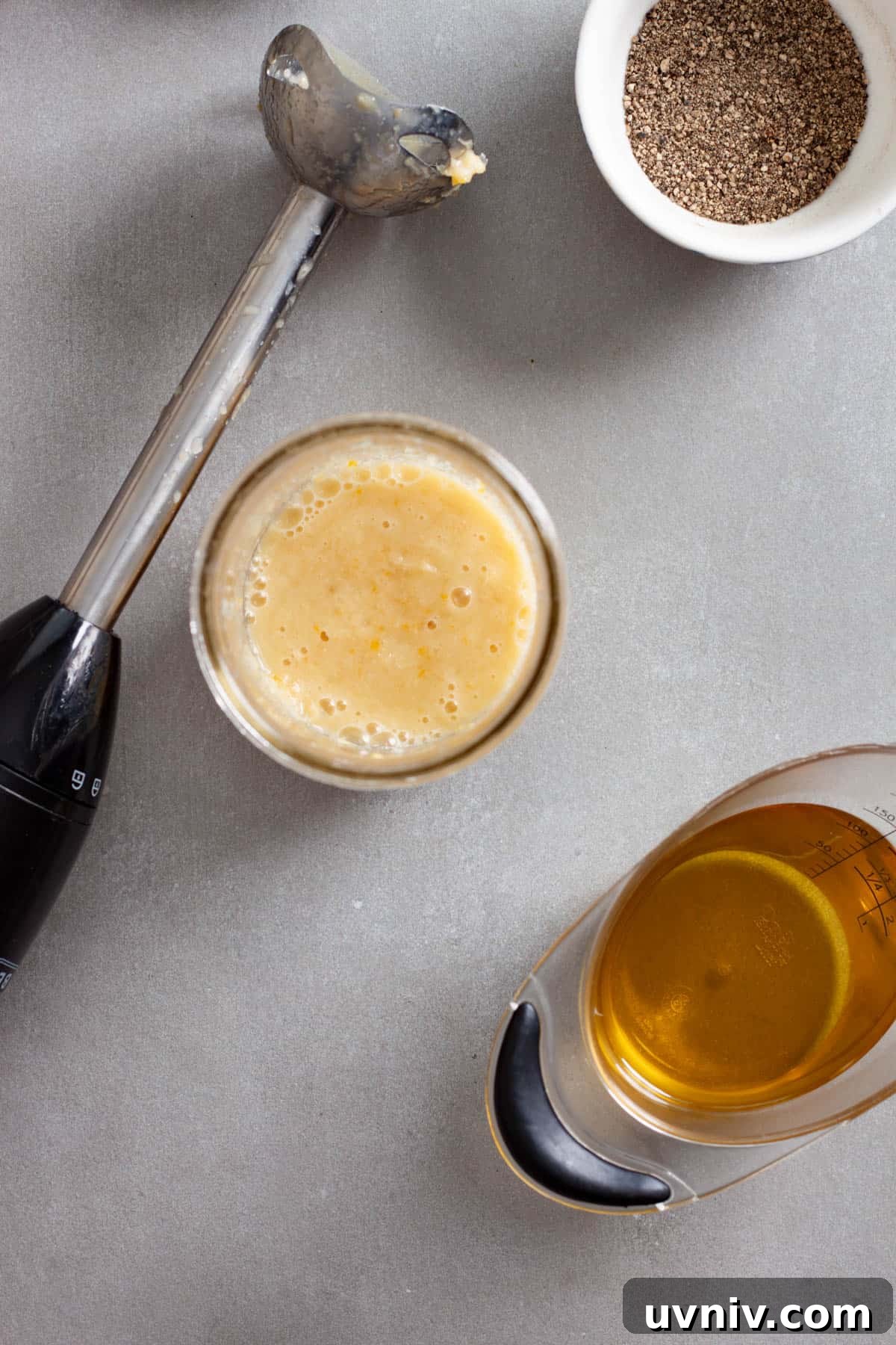 Zesty Preserved Lemon Vinaigrette Recipe for Salads & Marinades 5 Preserved lemon vinaigrette without the oil added in a mason jar with a hand blender to the side.