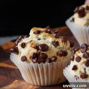 chocolate chip muffin on a wooden cutting board